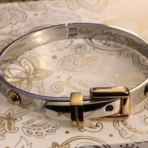 Michael Kors silver and gold buckle bracelet.
